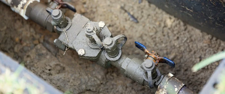 Backflow regulator device of an irrigation system in Cary, NC.