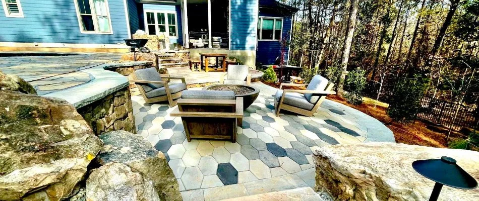 Paver patio in Pittsboro, NC, with chairs and a fire pit.