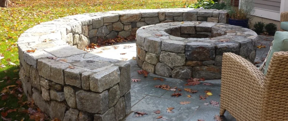 Fire pit with seating wall in Cary, NC.